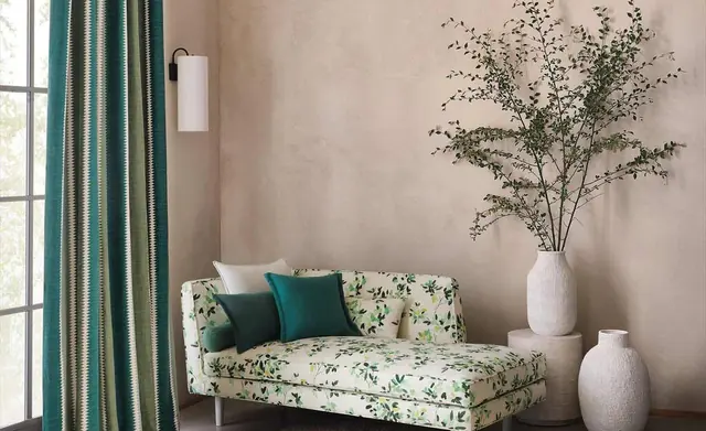 Romo patterned curtains, upholstery and cushions in a light contemporary interior