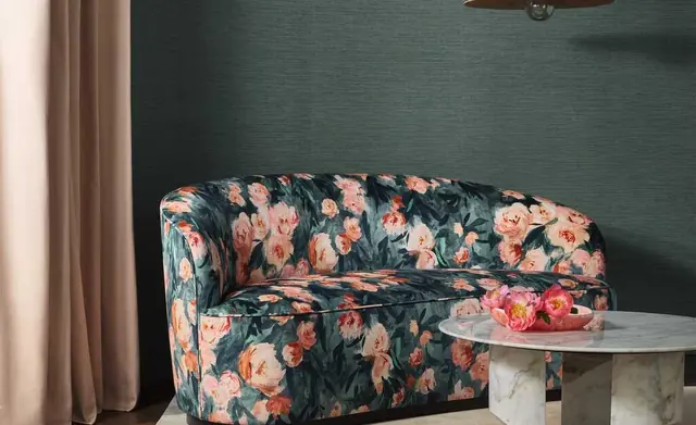Romo floral upholstery and textured curtains in a coordinated living space