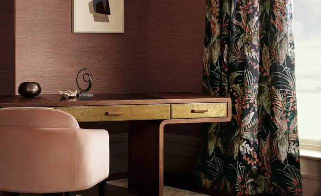 Romo patterned curtain and upholstered chair in a contemporary workspace