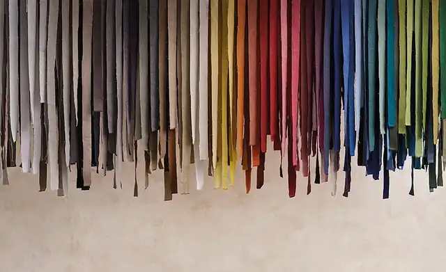Romo Linara fabric colour range with hanging swatches from neutrals to bright shades