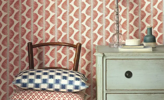 Romo patterned cushions arranged on a chair in a coordinated interior