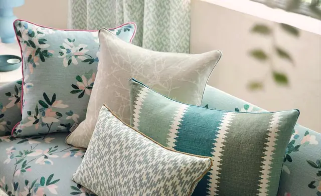 Selection of Romo patterned and textured cushions on a sofa