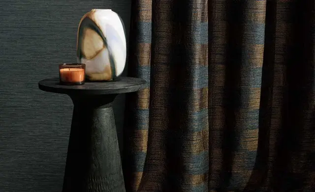 Romo textured curtain fabric in a dark contemporary interior