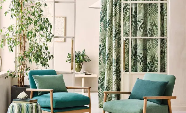 Romo furnishings arranged with a pale textured rug in a contemporary room