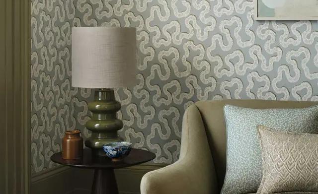 Romo patterned wallcovering with coordinating chair and cushions