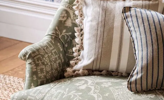 Chair upholstered in patterned Sanderson fabric with coordinating cushions
