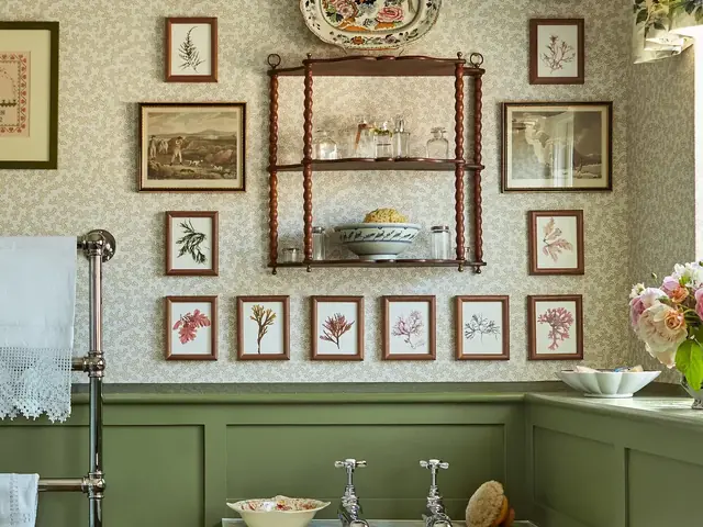 Sanderson green paint coordinated with patterned wallpaper in a bathroom