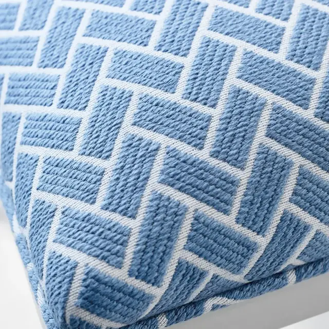 Close view of blue small-scale geometric upholstery fabric