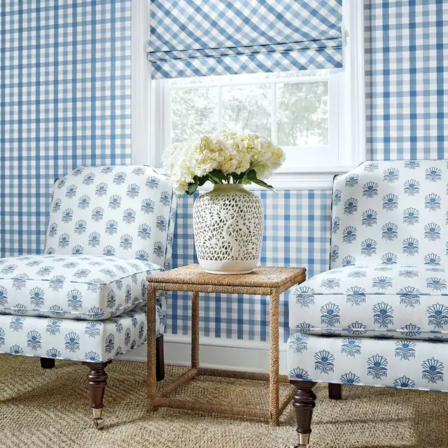 Soft blue Thibaut check wallpaper in a light and relaxed sitting room