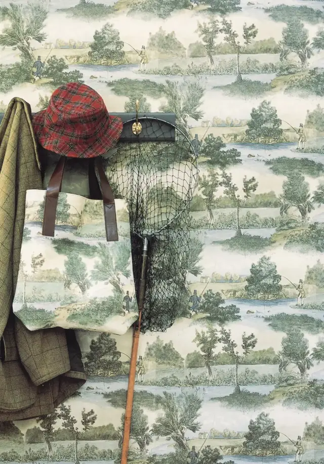 Green fly fishing toile wallpaper in a hallway with traditional furniture