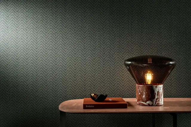 Subtle dark green Arte Amaranth textured chevron wallpaper in a contemporary interior