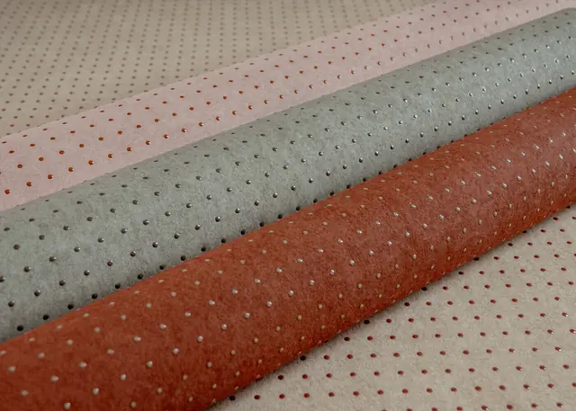Textured dot wallpaper rolls in several Le Corbusier colours