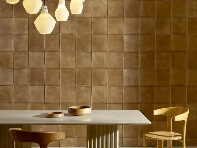 Textured luxury wallcovering with a constructed architectural surface