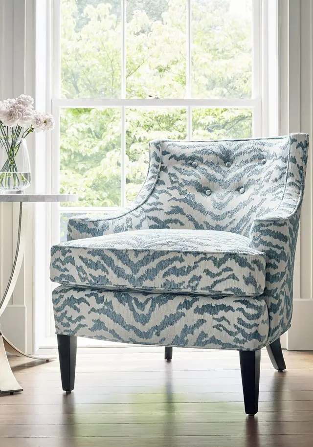 Armchair upholstered in blue and cream Thibaut Aja animal print fabric