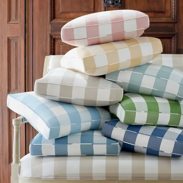 Stack of Thibaut Hammond Check fabrics in blue, green, pink and neutral colours