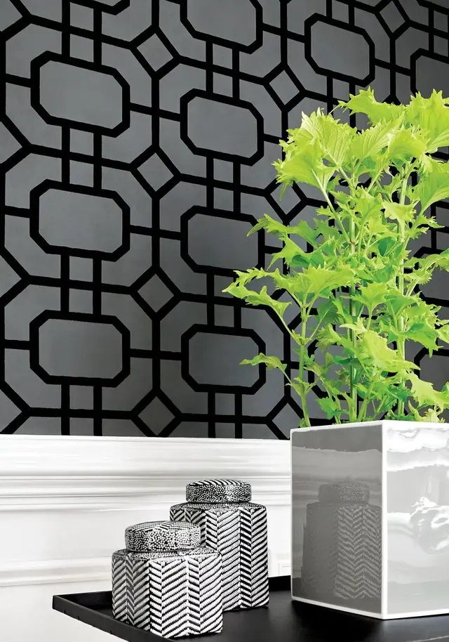 Close-up of Thibaut Portier black flock wallpaper showing its raised geometric surface