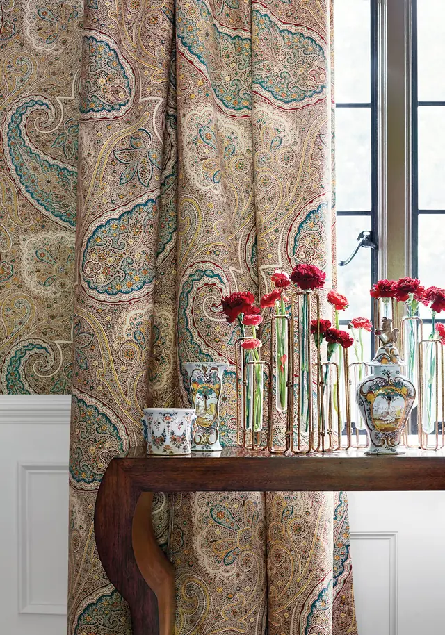 Full-length curtains in a large-scale multicoloured Thibaut Sherrill Paisley fabric