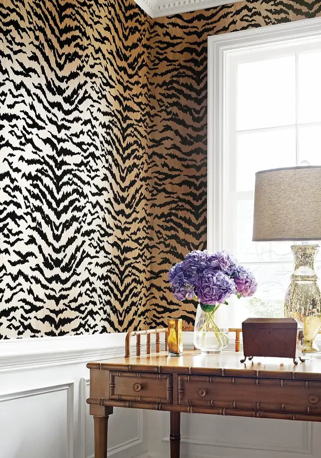 Thibaut Tiger black and gold animal flock wallpaper in a dramatic room