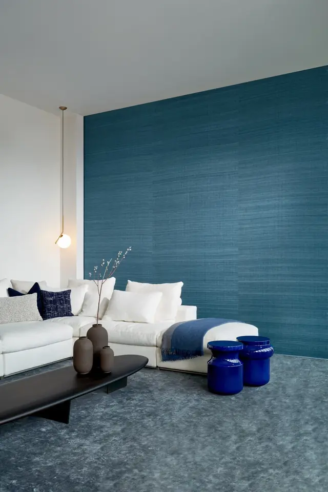 Tonal blue textured wallcovering in a contemporary living room