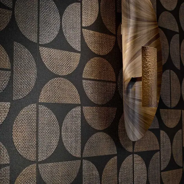 Luxury dark geometric wallcovering with tactile woven circular forms