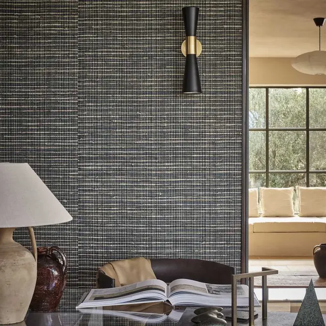 Dark blue and charcoal woven grasscloth wallcovering in a contemporary interior