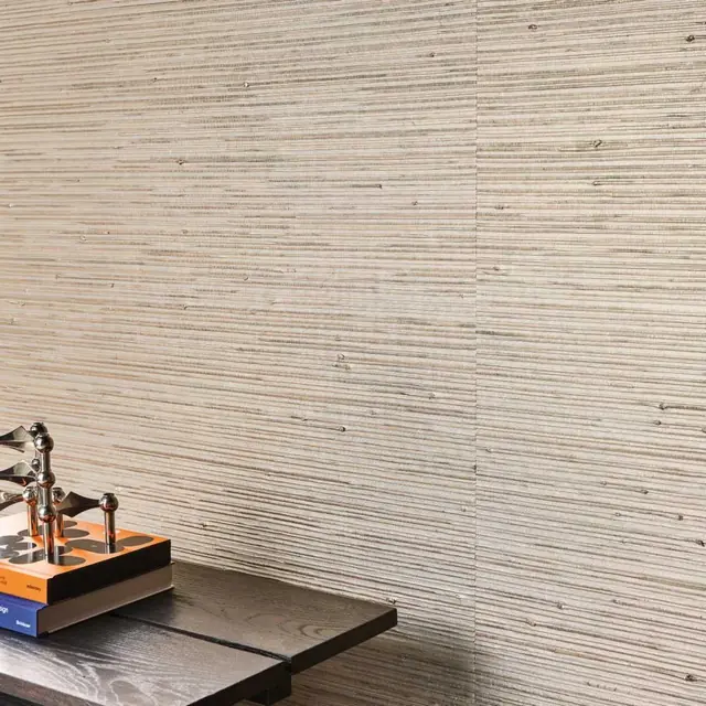 Neutral grasscloth wallcovering showing horizontal natural fibre texture and visible panel joins