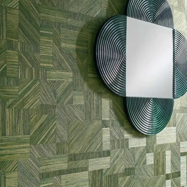 Green patterned grasscloth wallcovering arranged in a geometric woven design