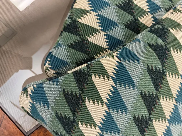 Close-up of two patterned bespoke cushions showing coordinated cutting and piped edges