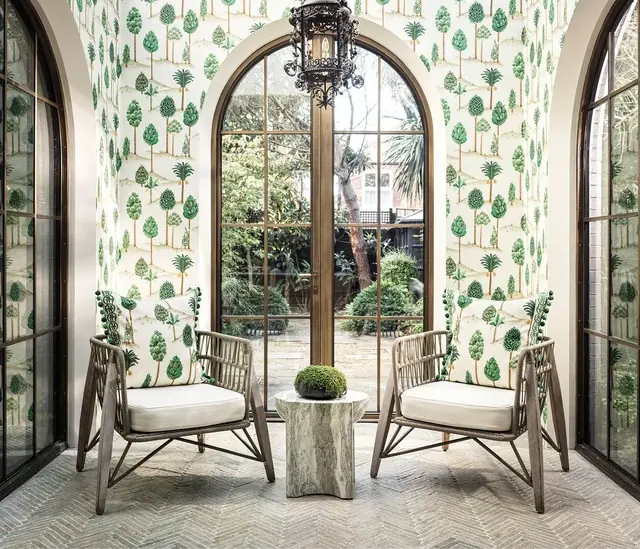Osborne & Little Foresta wallpaper in an arched-window interior