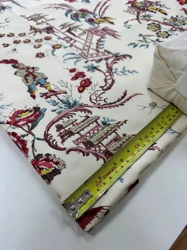 TM Interiors workroom measuring designer fabric for a made-to-measure furnishing project