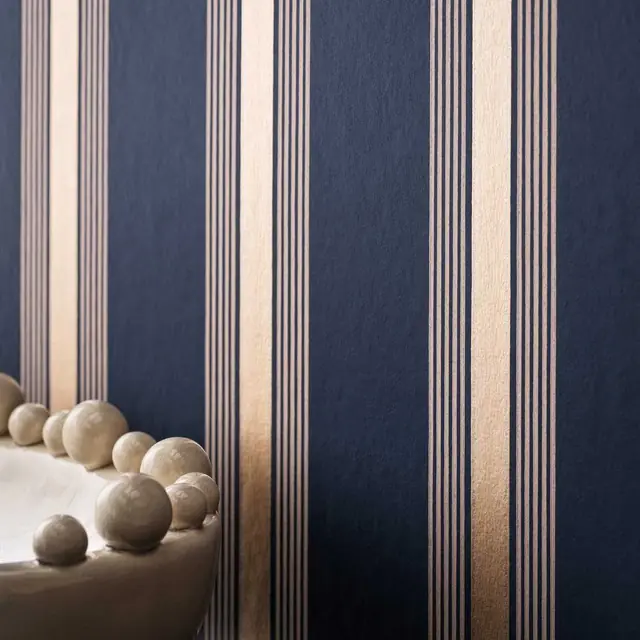 Dark navy and metallic striped wallpaper with fine linear detailing