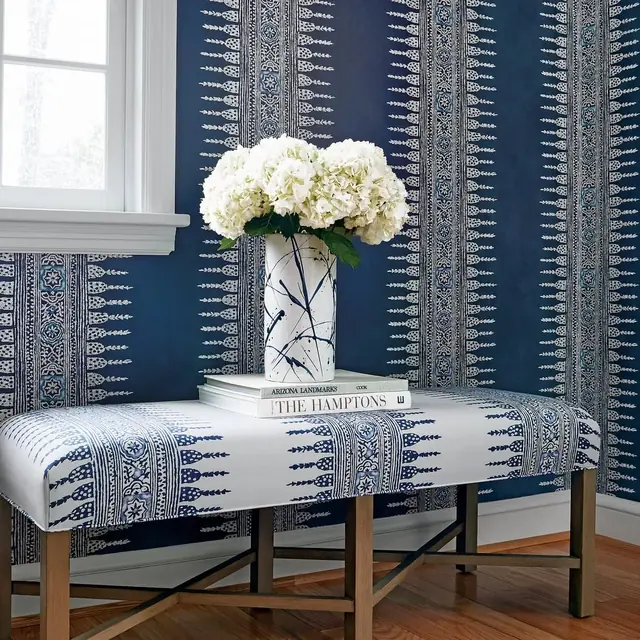 Navy and white decorative striped wallpaper in a tailored interior
