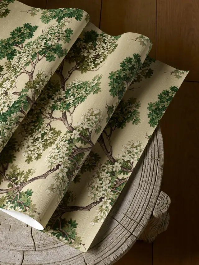 Rolled botanical vinyl wallpaper showing the surface texture and printed finish