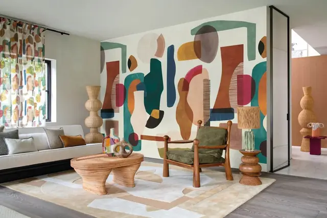 Colourful contemporary abstract wallpaper used across a living room wall