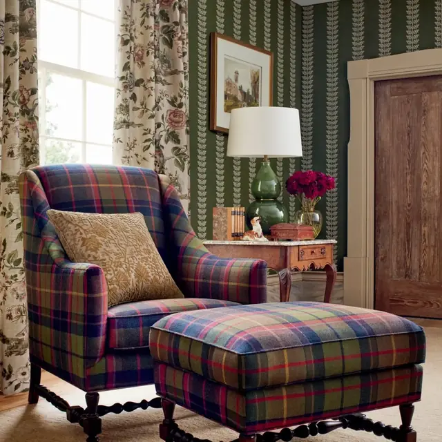 Traditional tartan upholstery used on a coordinating armchair and footstool