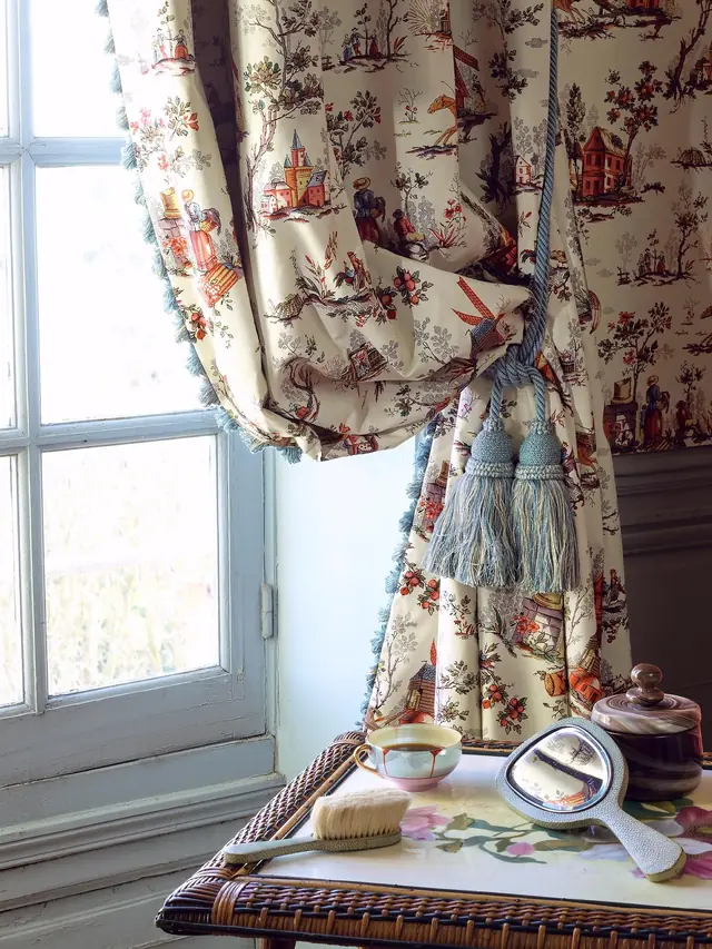 Traditional multicoloured Toile de Jouy curtain showing pattern scale and drape