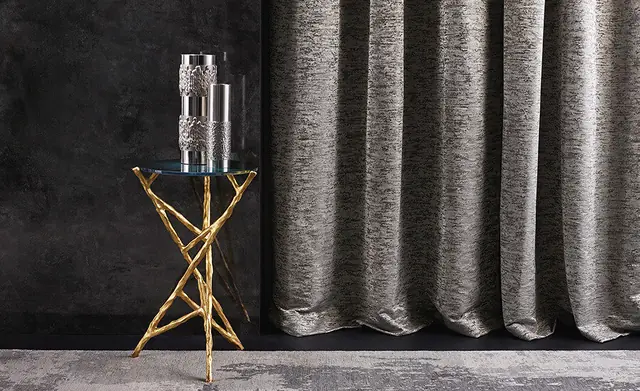 Full-length grey Trevira curtain fabric in a contemporary interior