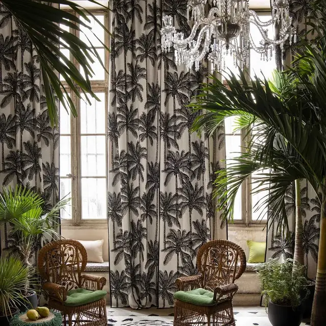 Monochrome palm botanical curtains in a conservatory-style interior