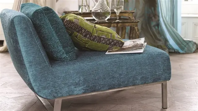 Blue upholstered chair in textured fabric