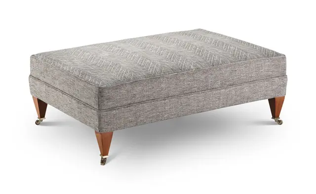 Footstool used as an example for estimating upholstery fabric