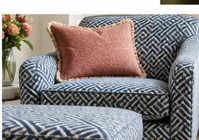 Patterned upholstered armchair showing how fabric design is positioned across a furniture piece
