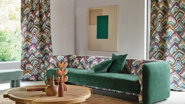 Green upholstered sofa with patterned designer fabrics