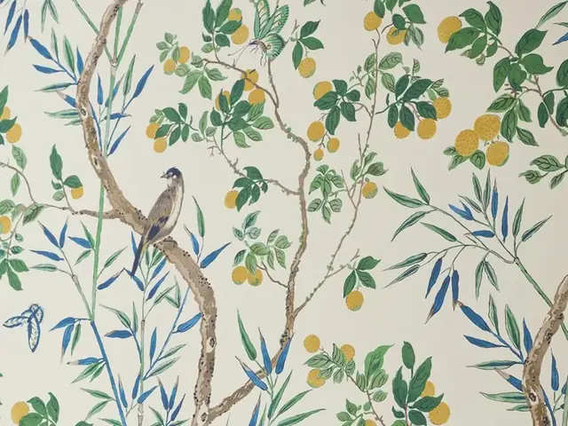 Close-up of illustrated vintage floral wallpaper with branches birds butterflies and leaves