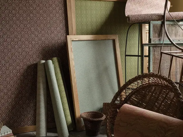 Vintage-inspired wallpaper rolls and small-scale patterns in muted colours