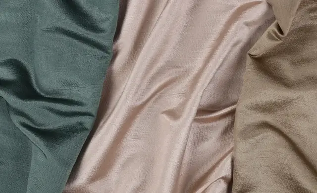 Close-up of softly draped viscose fabrics showing texture and lustre