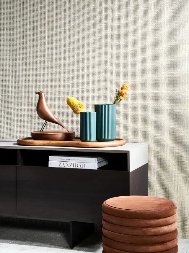 Natural woven wallcovering in a neutral interior showing a fine tactile surface