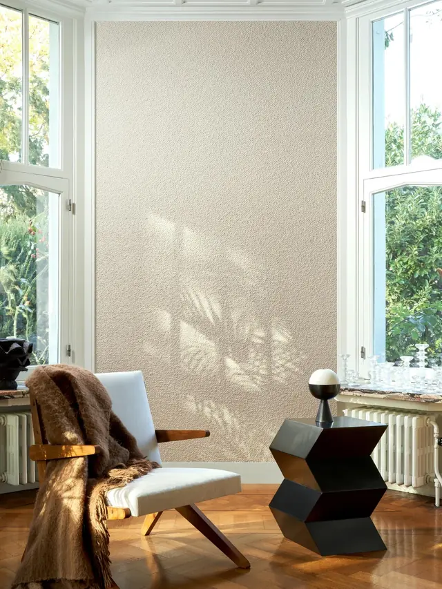 Subtle textile wallcovering used in a bright living space