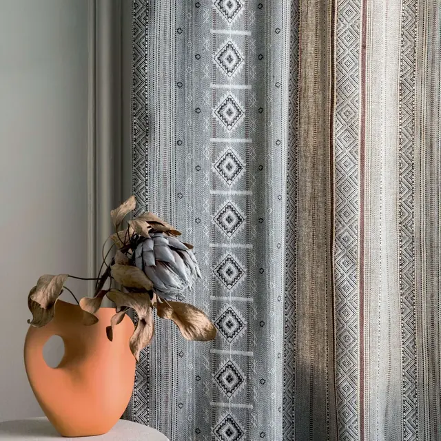 Textured woven cotton curtain fabric with decorative vertical pattern