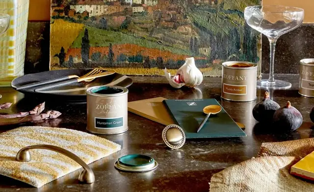 Zoffany paint colours, fabric and furnishing materials coordinated on a table