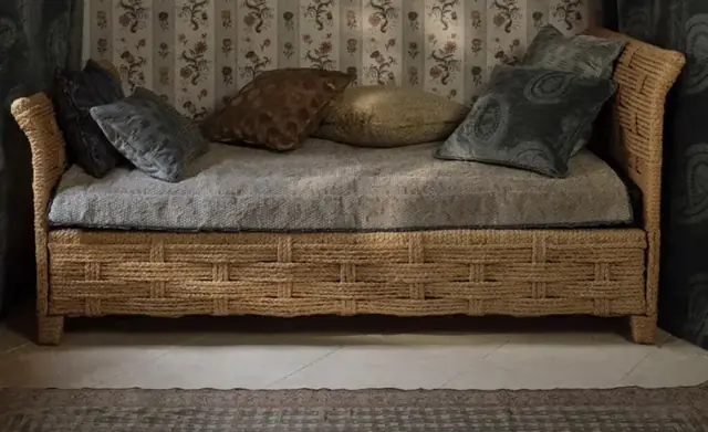 Layered Zoffany cushions on an upholstered daybed
